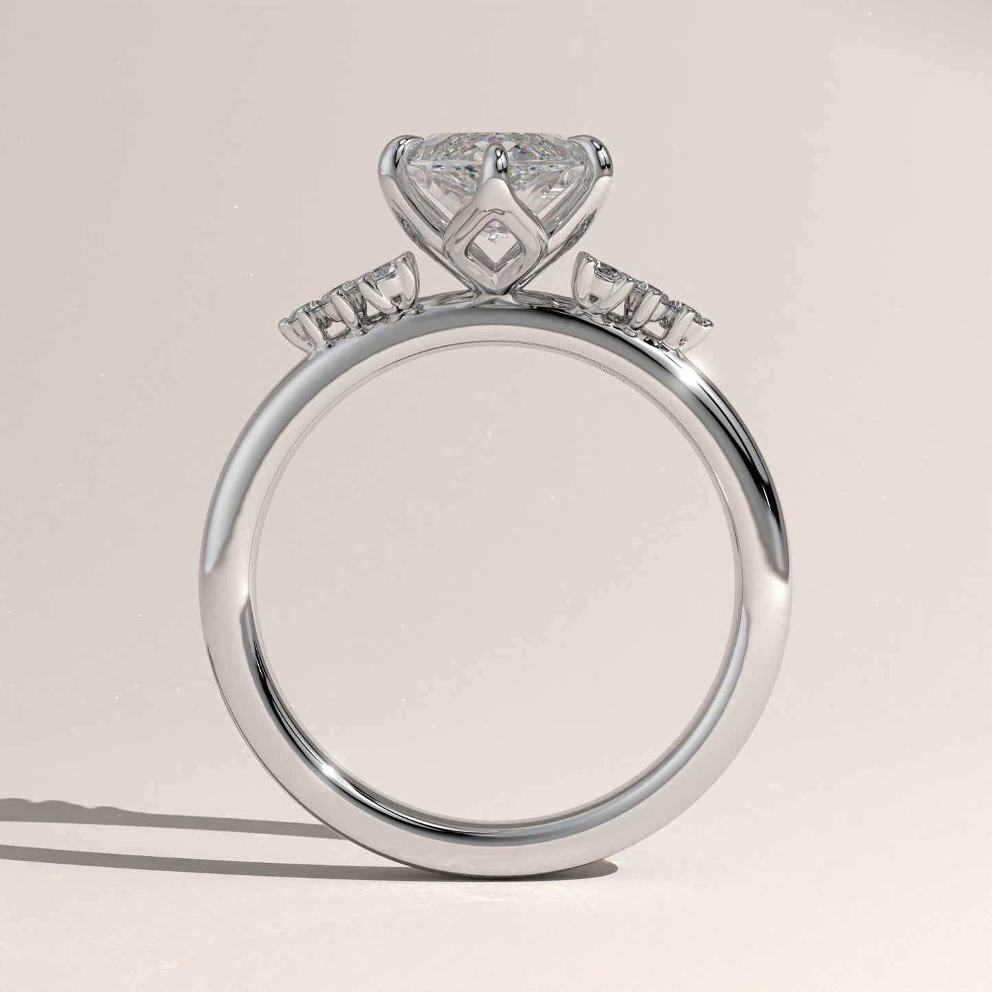 The Oval Claw Solitaire with Clustered Round Shoulder Stones Engagement Ring