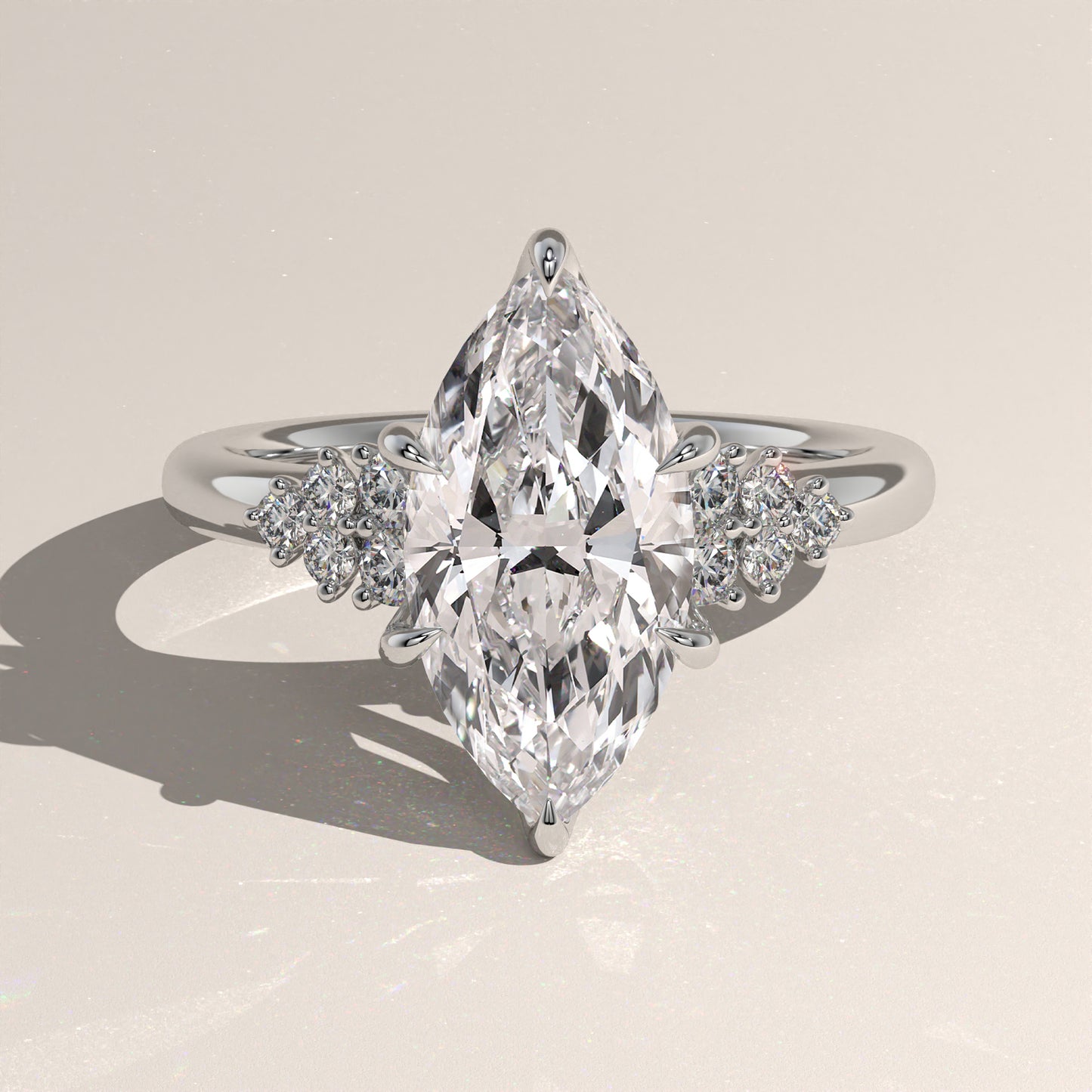 The Oval Claw Solitaire with Clustered Round Shoulder Stones Engagement Ring