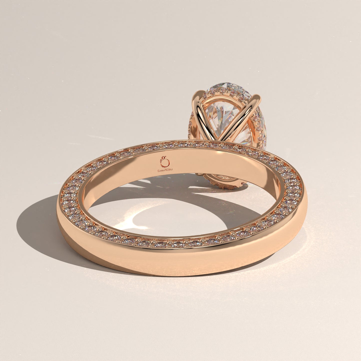 The Solitaire Cigar Pavé Band Oval Engagement Ring