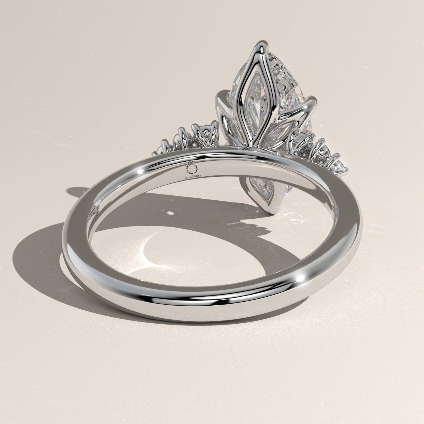 The Oval Claw Solitaire with Clustered Round Shoulder Stones Engagement Ring