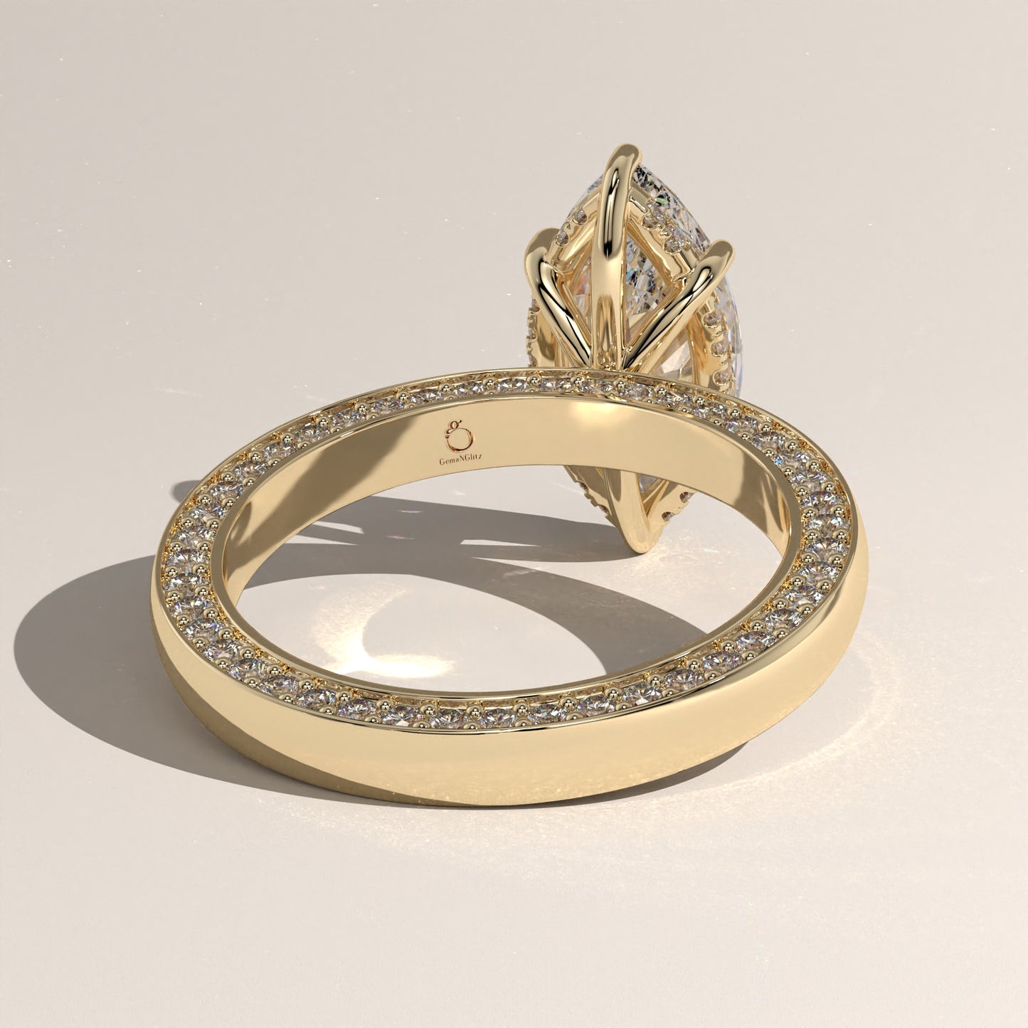 The Solitaire Cigar Pavé Band Marquise Engagement Ring