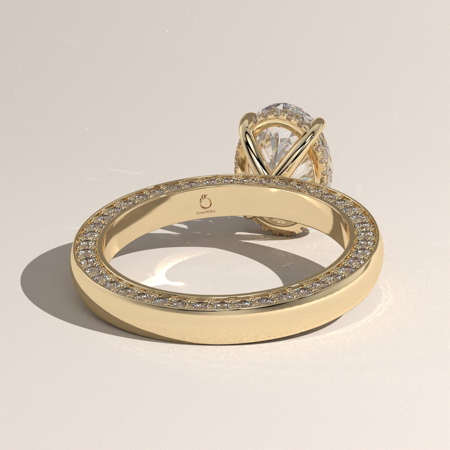 The Solitaire Cigar Pavé Band Oval Engagement Ring
