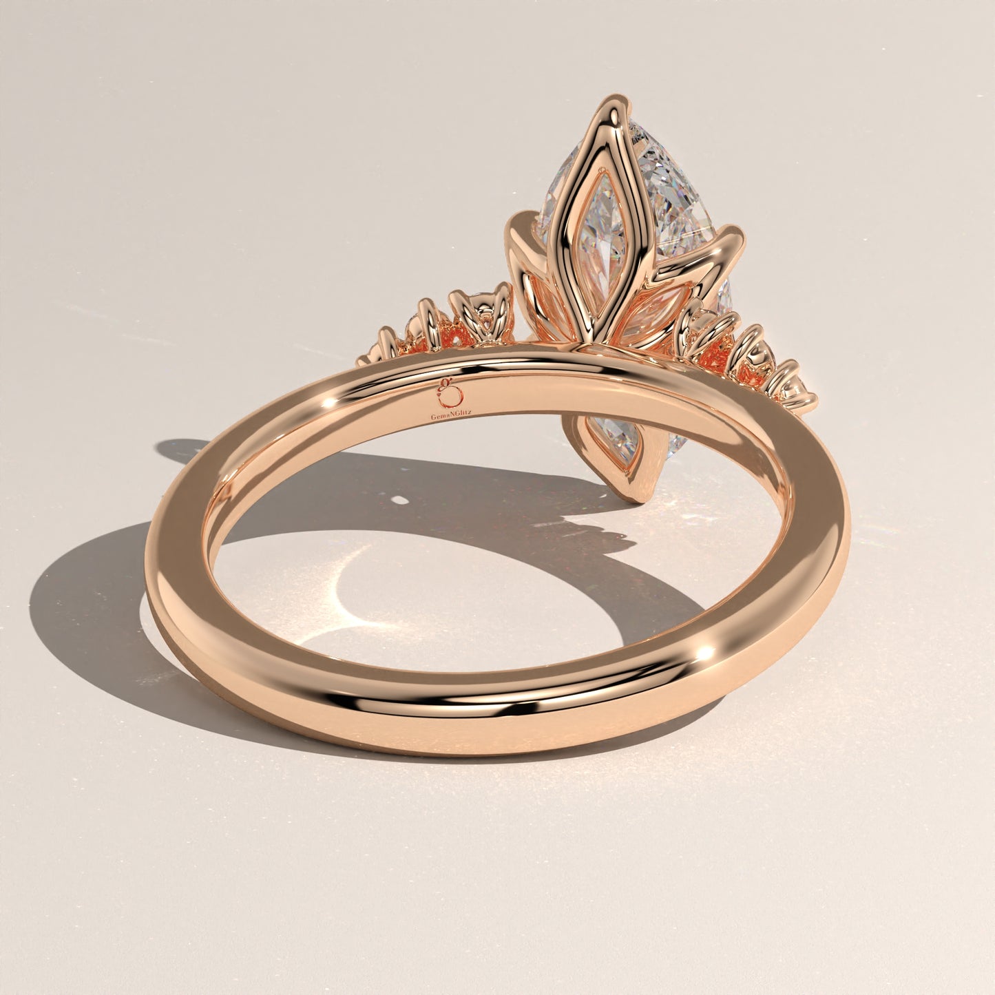 The Oval Claw Solitaire with Clustered Round Shoulder Stones Engagement Ring