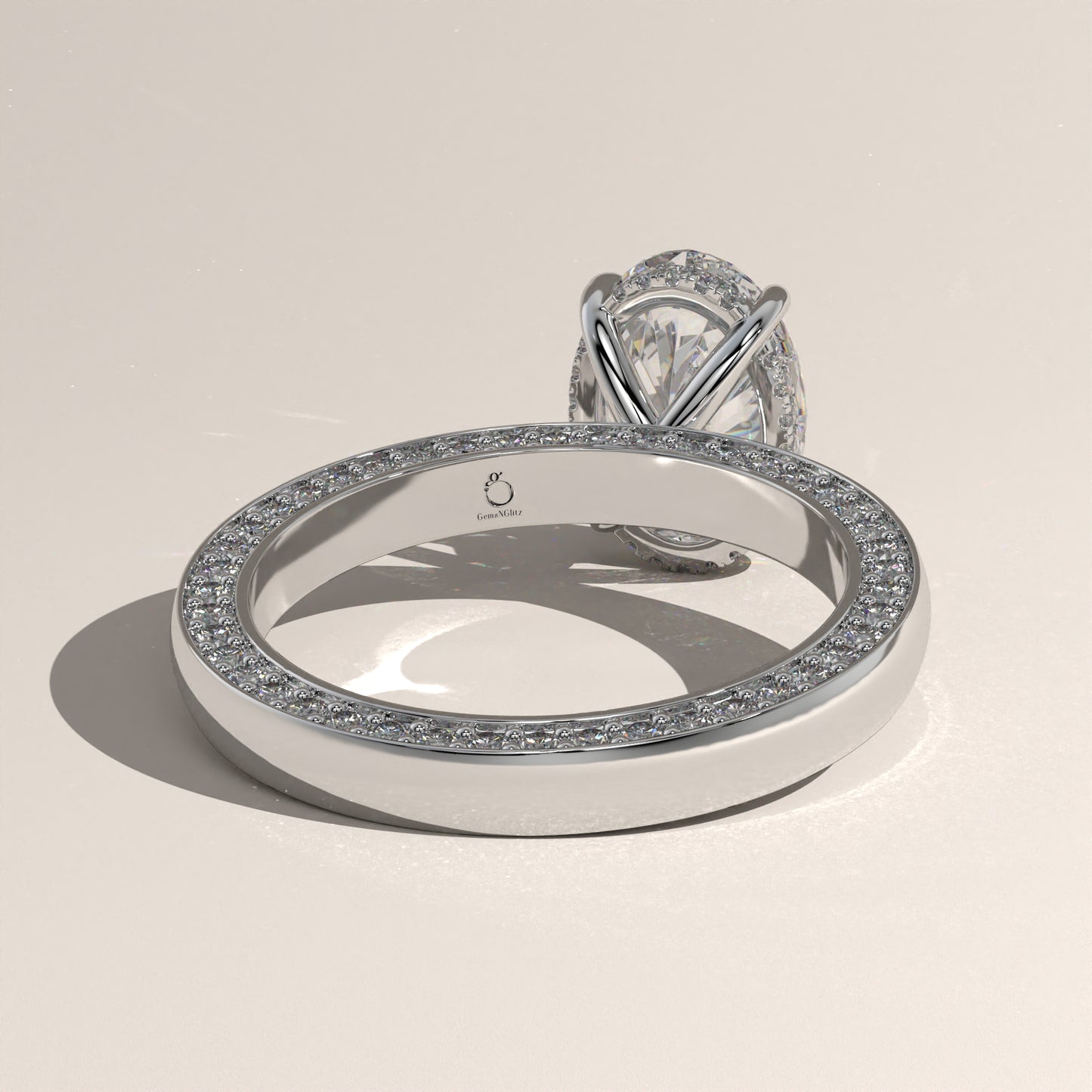 The Solitaire Cigar Pavé Band Oval Engagement Ring
